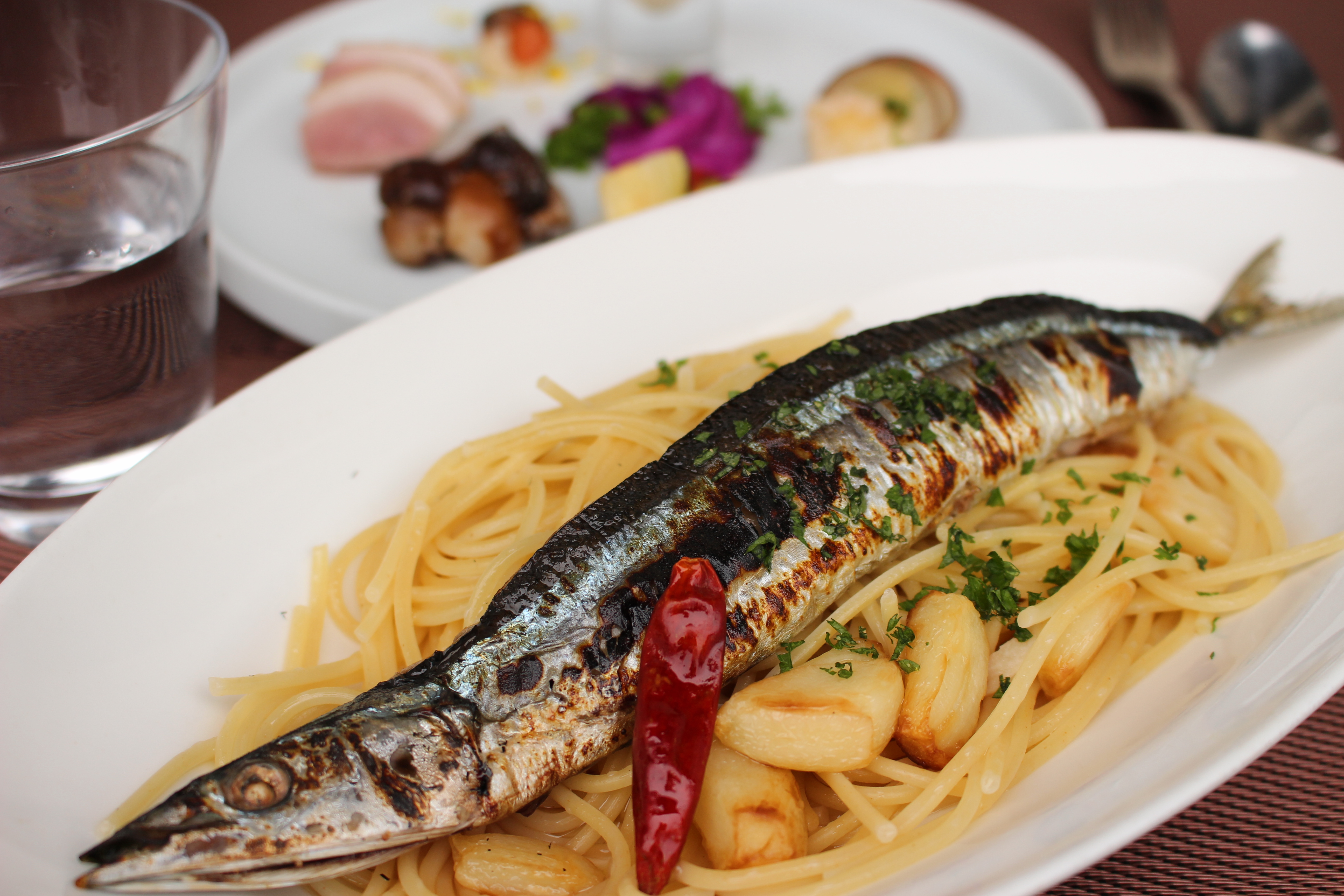 Kiyoshi さんの 丸ごとサンマのペペロンチーノと京町屋。